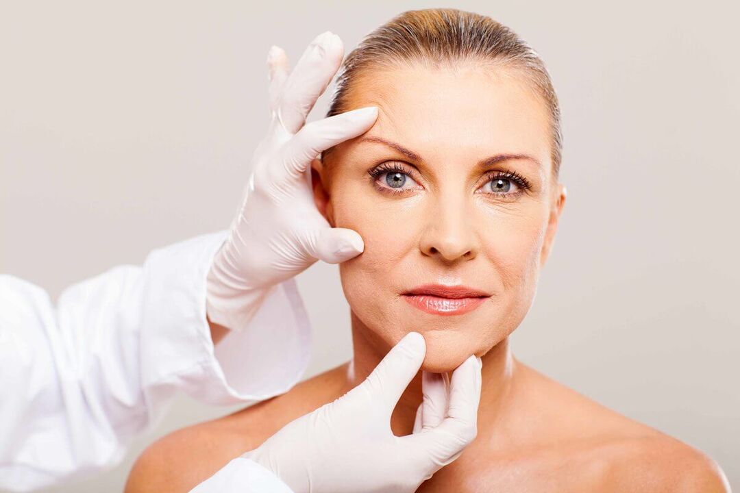 The cosmetologist selects the appropriate method for rejuvenating the skin of the face